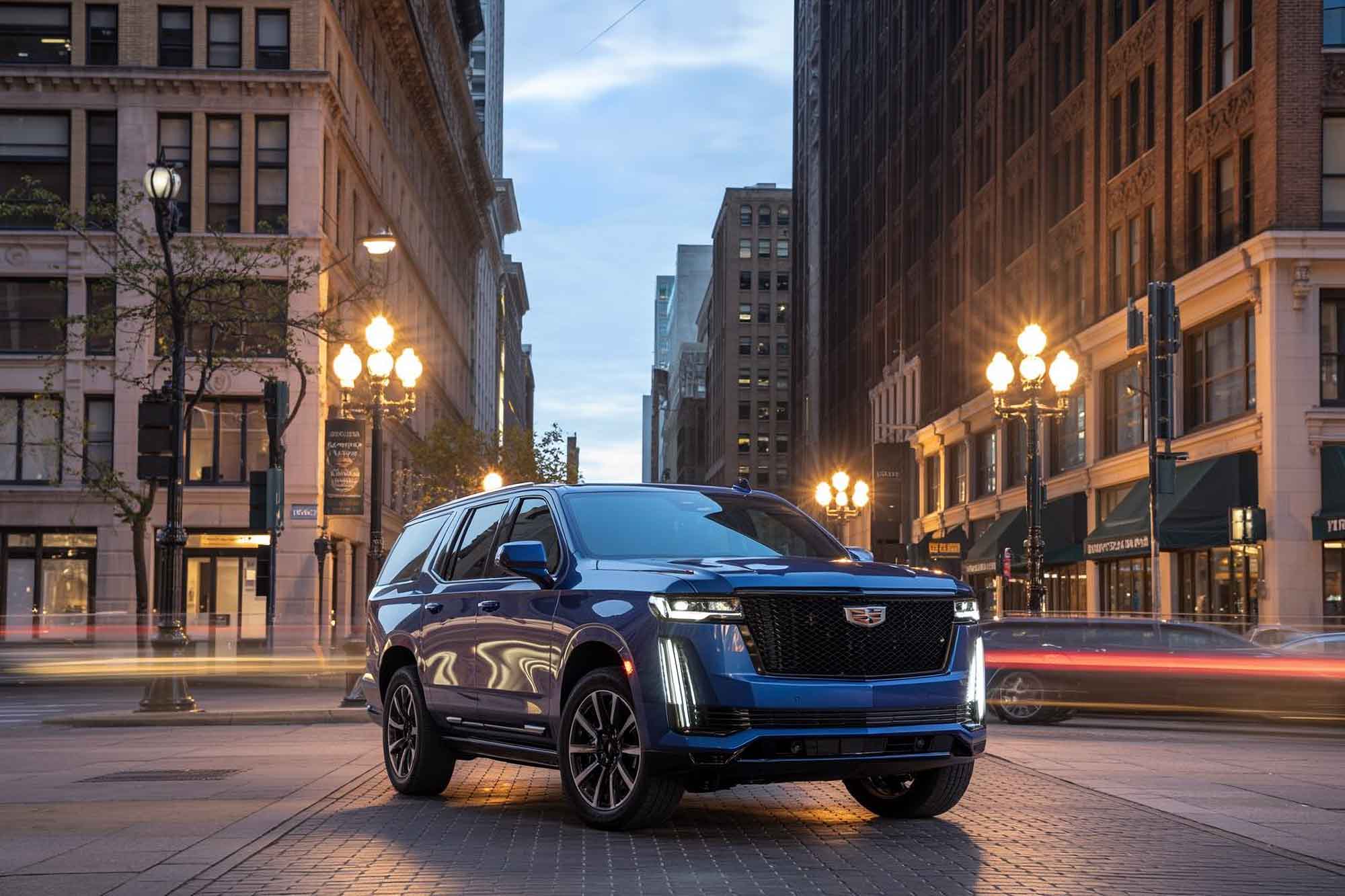 Blue escalade in the middle of street with buildings in background - our repair process - craigs collision