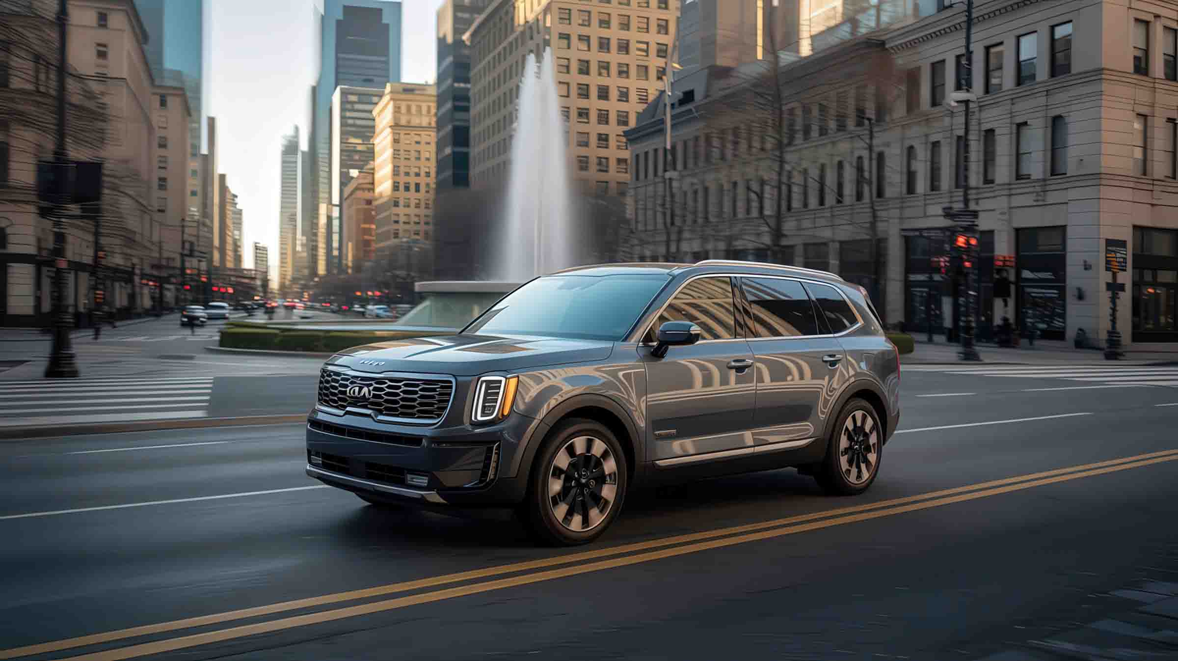 Silver kia suv driving through city with waterfall in background - auto paint repair - craigs collision